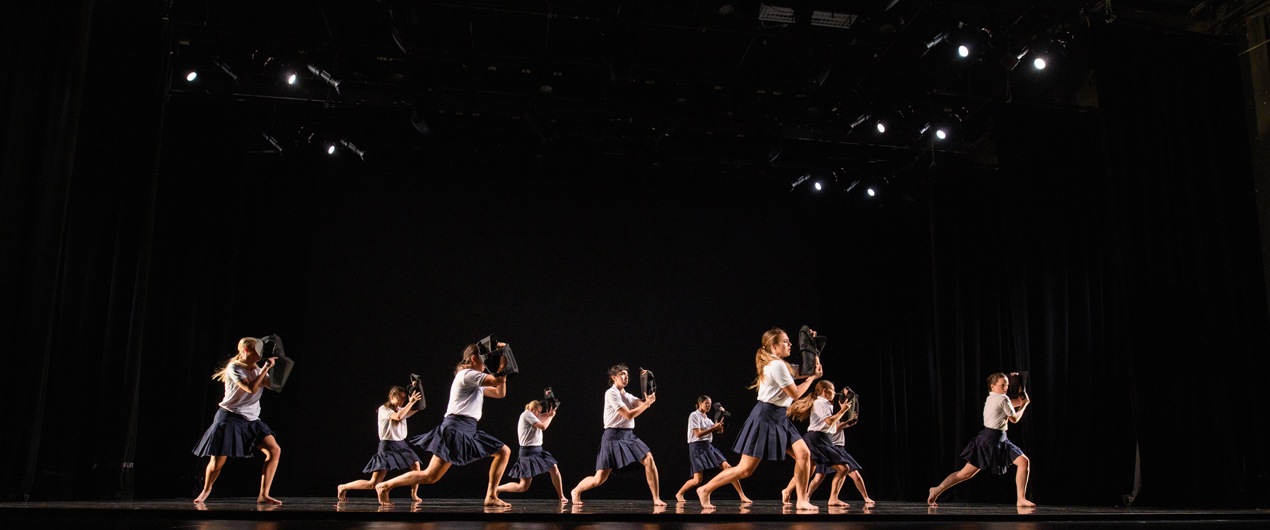 Dancers perform onstage at the Fall '19 Faculty Concert