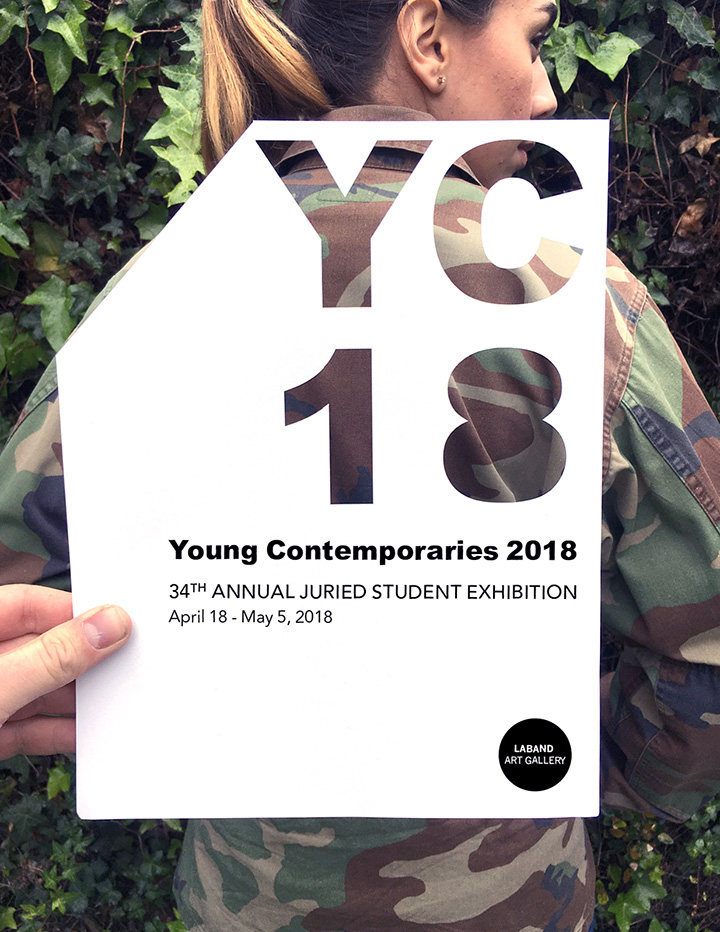 Young Contemporaries 2018 flyer being held over a student's camo-pattern jacket