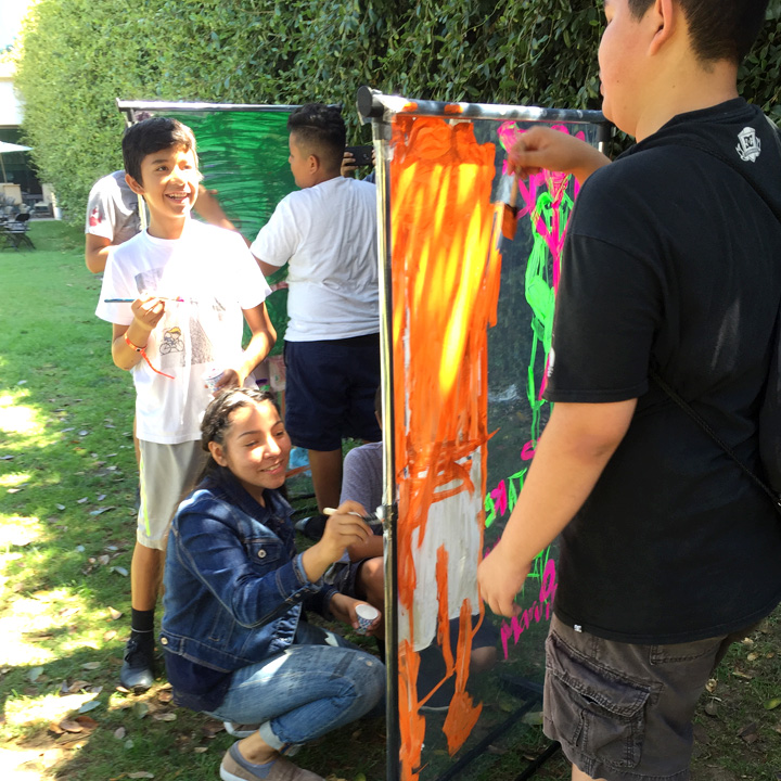 Kids making artwork during the 2018 Summer Arts Workshop.