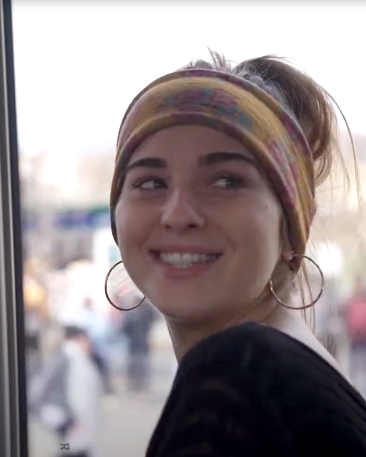 Photo of a theatre student in Europe riding a bus.