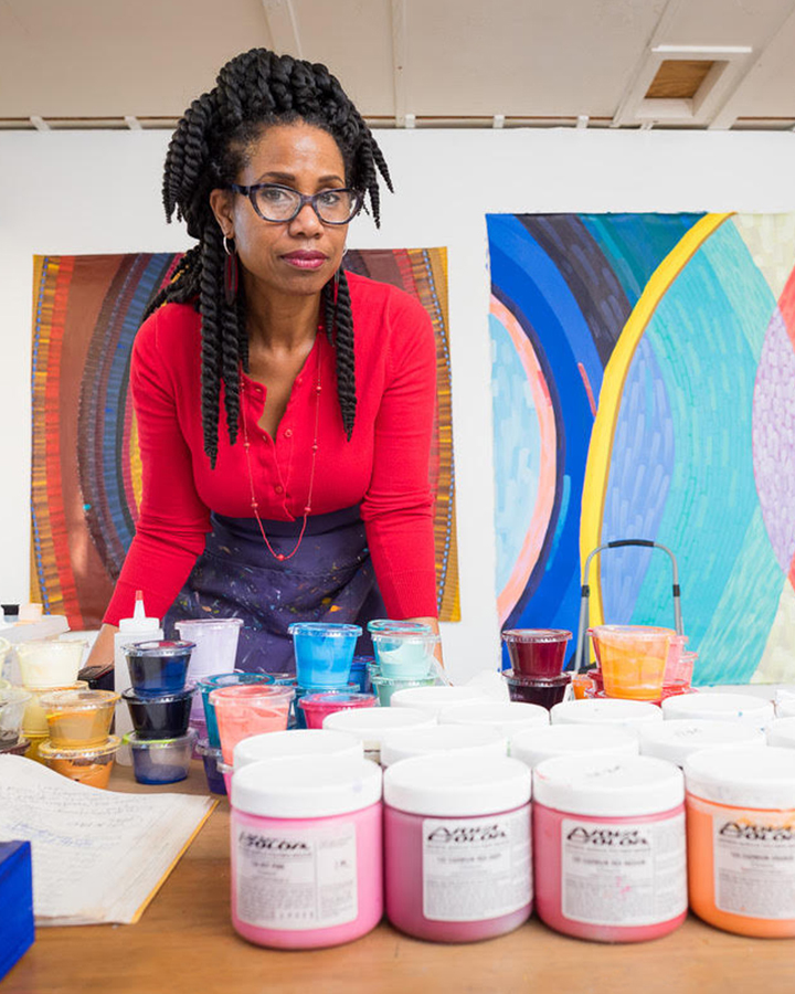 June Edmonds standing in front of her work.