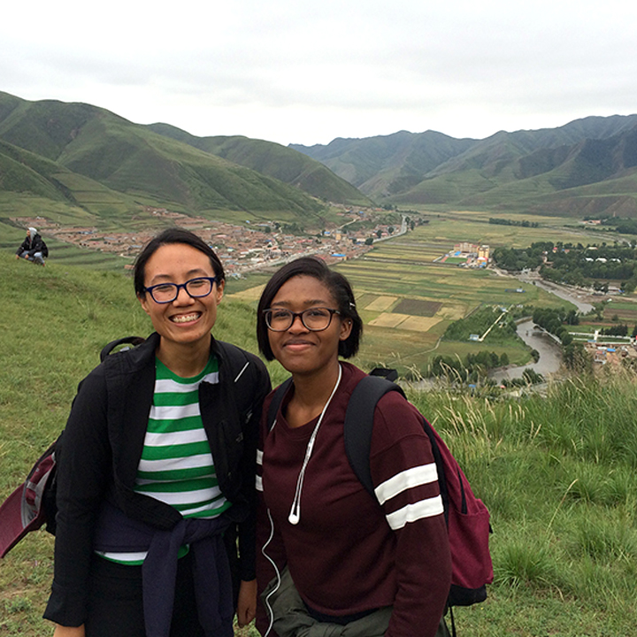 Two people pose for a photo while on a trip abroad.