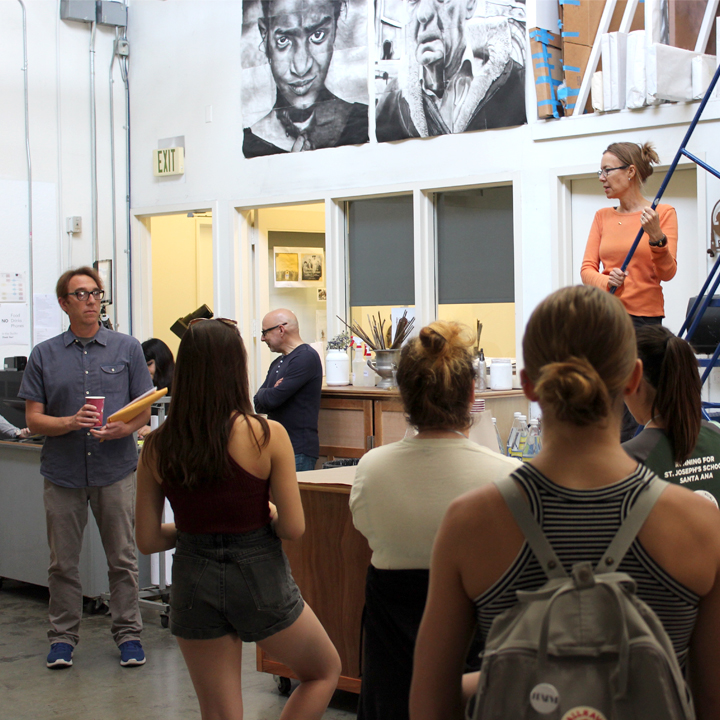 Professors Damon Willick and Jane Brucker talk to students in the Drawing Studio.