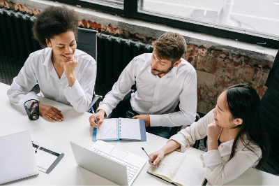 Three diverse young businesspeople having a meeting