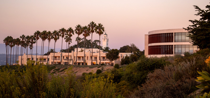 A view of the bluff, with the library, Jesuit community, and Sacred Heart Chapel in the background.