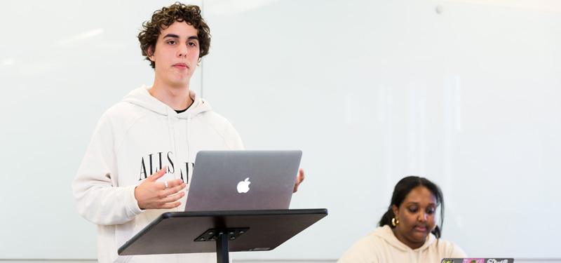 A student speaking at the podium.