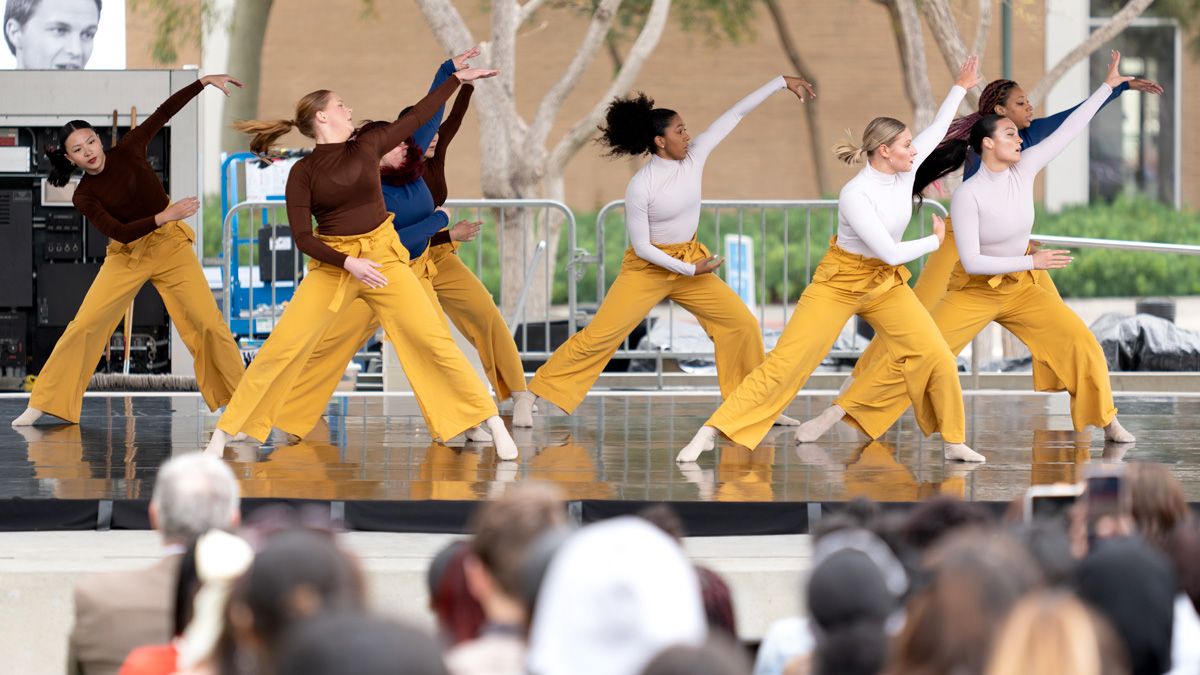 Students watching a Community Dance Project performance.
