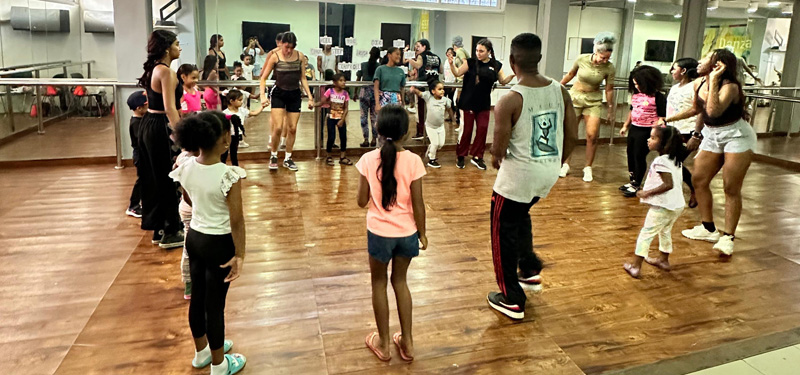 Dance students and kids participating in the Movement Exchange.