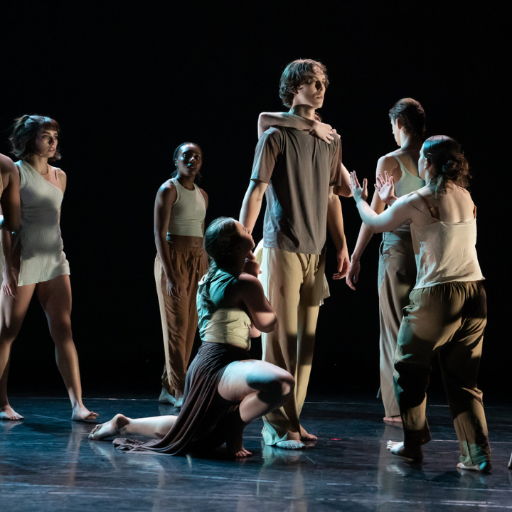 A group of dancers have drawn their attention to one dancer in particular.