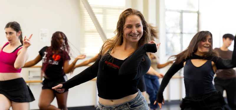 Students dancing in a studio.