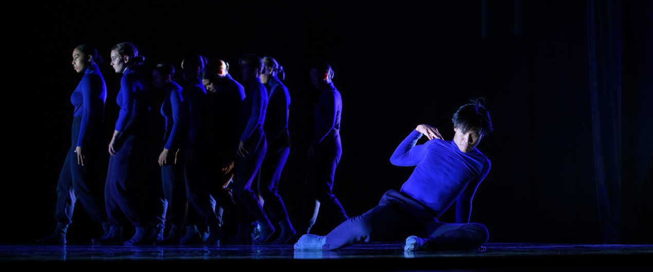 Dancers in blue performing at the Fall '19 Faculty Concert.
