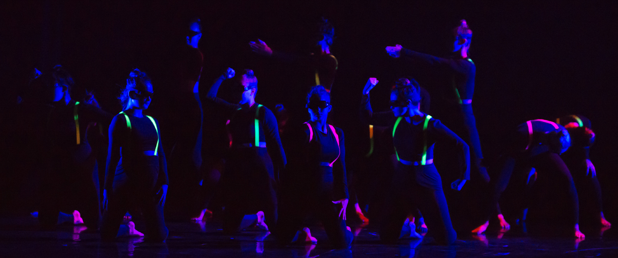 Group of dancers pose onstage at Spring '17 Student Concert.