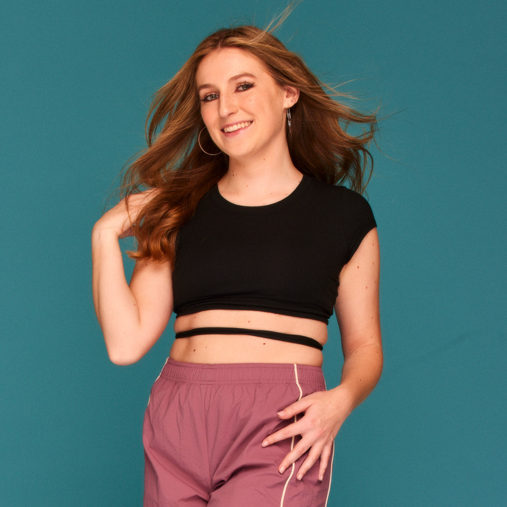 a woman posing showing off full body.