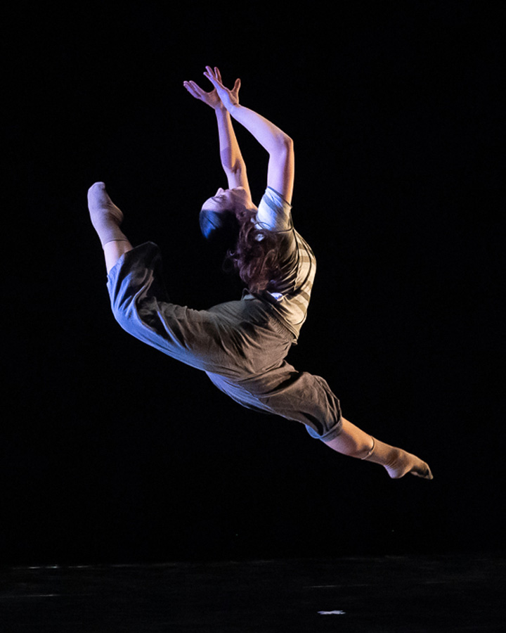 A dancer striking a pose midair.