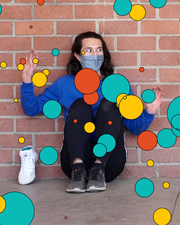 Dancer performs while animated shapes appear.