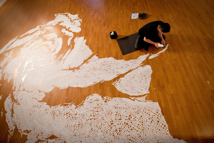 Motoi Yamamoto working on an installation using salt.