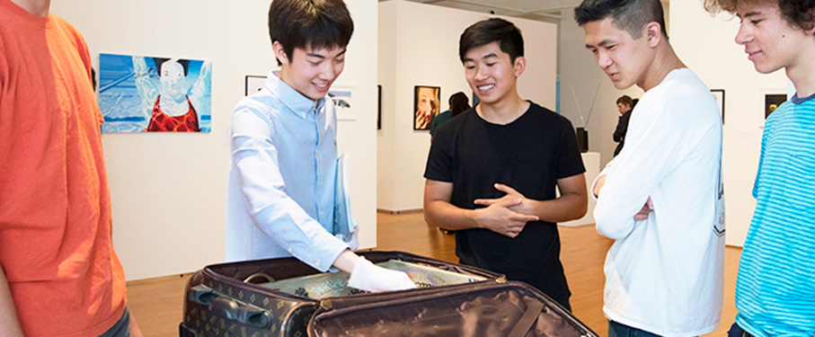A student artist giving a tour of his exhibit