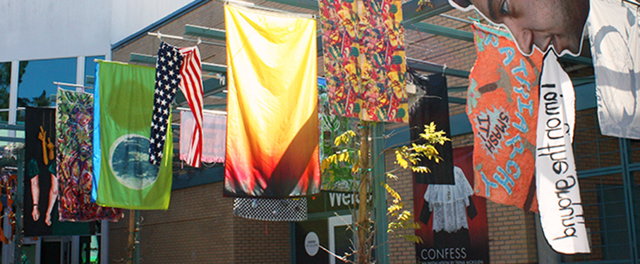 Artist's flags on display in Dunning courtyard