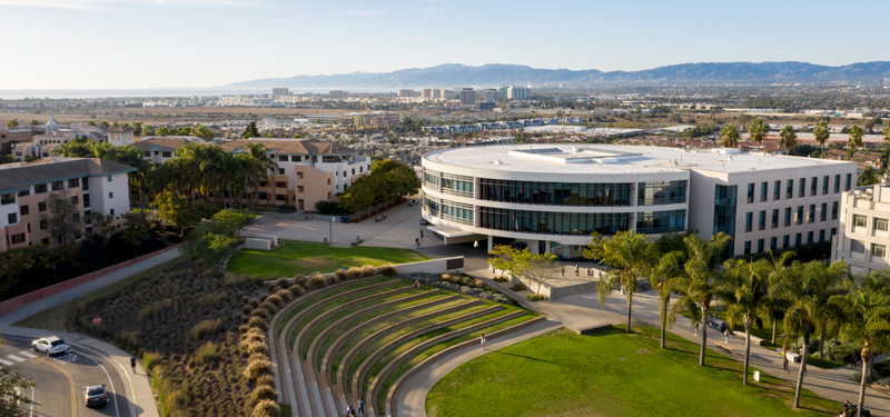 Overhead view of Lawton Plaza and Hannon Library, with LA in the background.