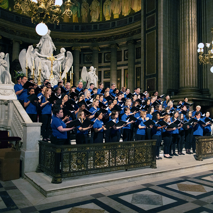 a large chorus performs in a European church