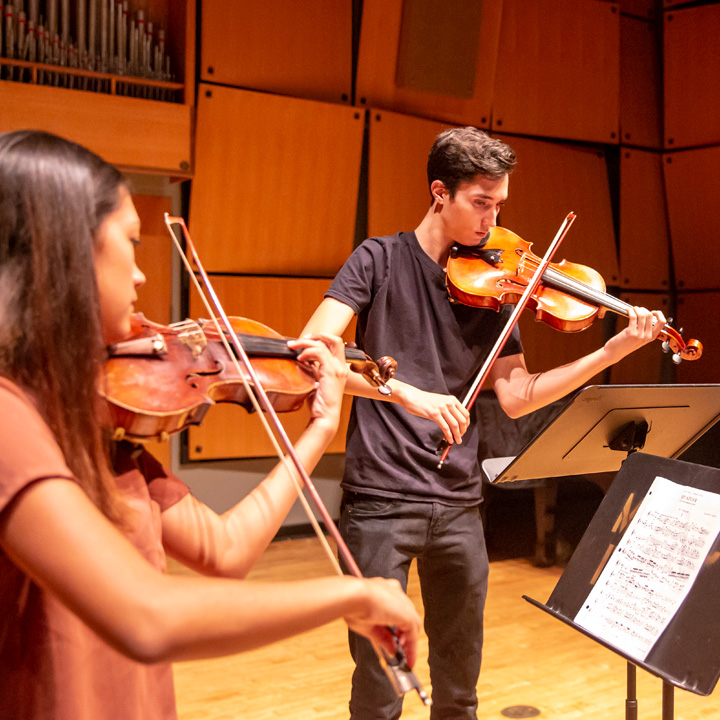 String Ensemble students playing their violins in Murphy Recital Hall.