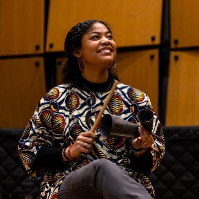 A student playing her instrument in the African Music Ensemble.