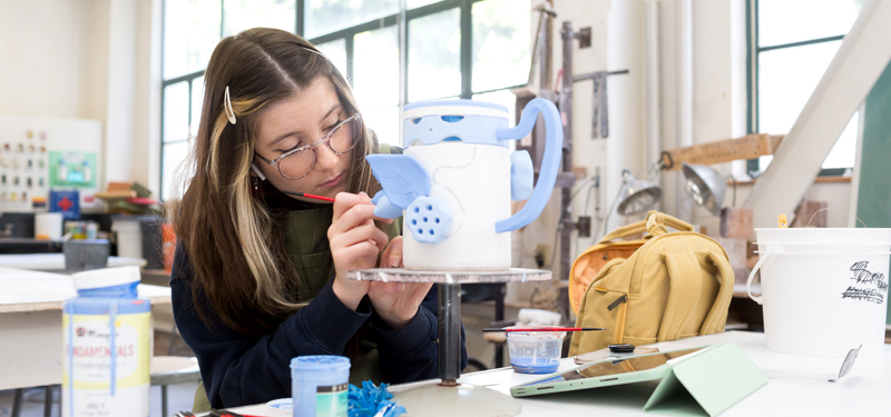 A student working in the ceramics studio.