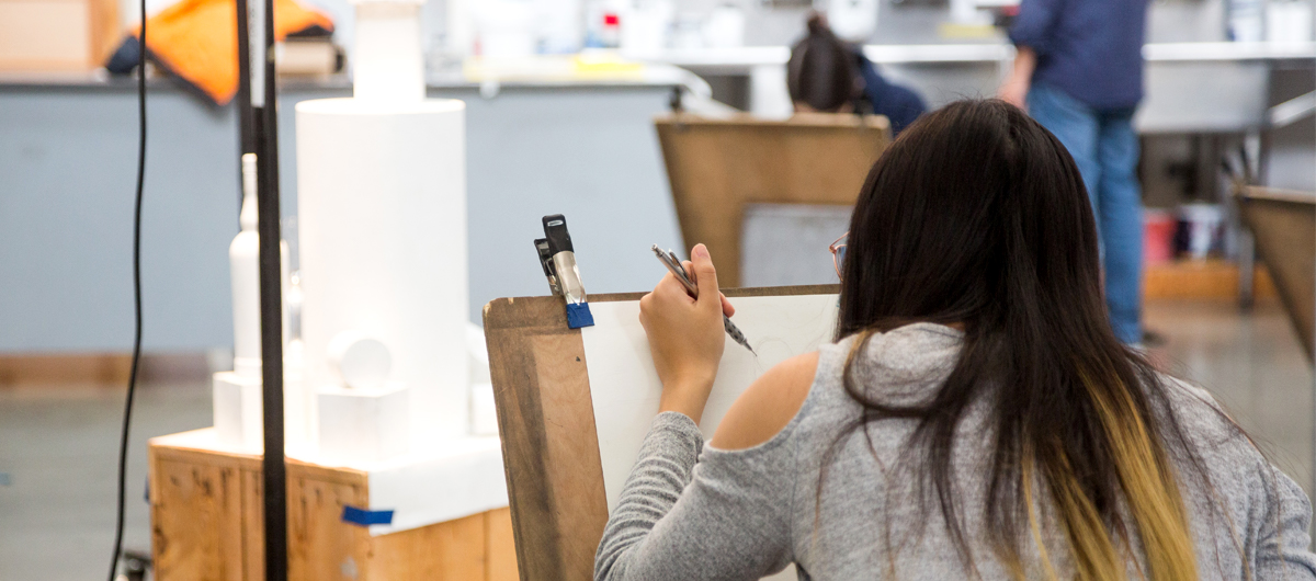 Students drawing a still life setup in the Drawing Studio.