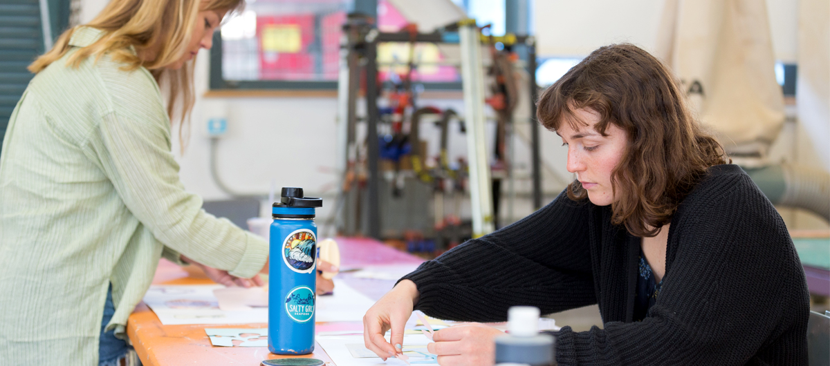 Students creating artwork in the Makerspace.