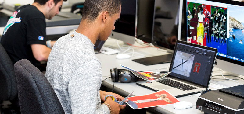 Graphic design students working on an assignment in the Design Lab.