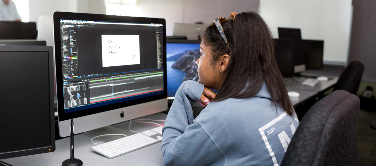 A student working on a motion graphics project for the Experimental Typography class.