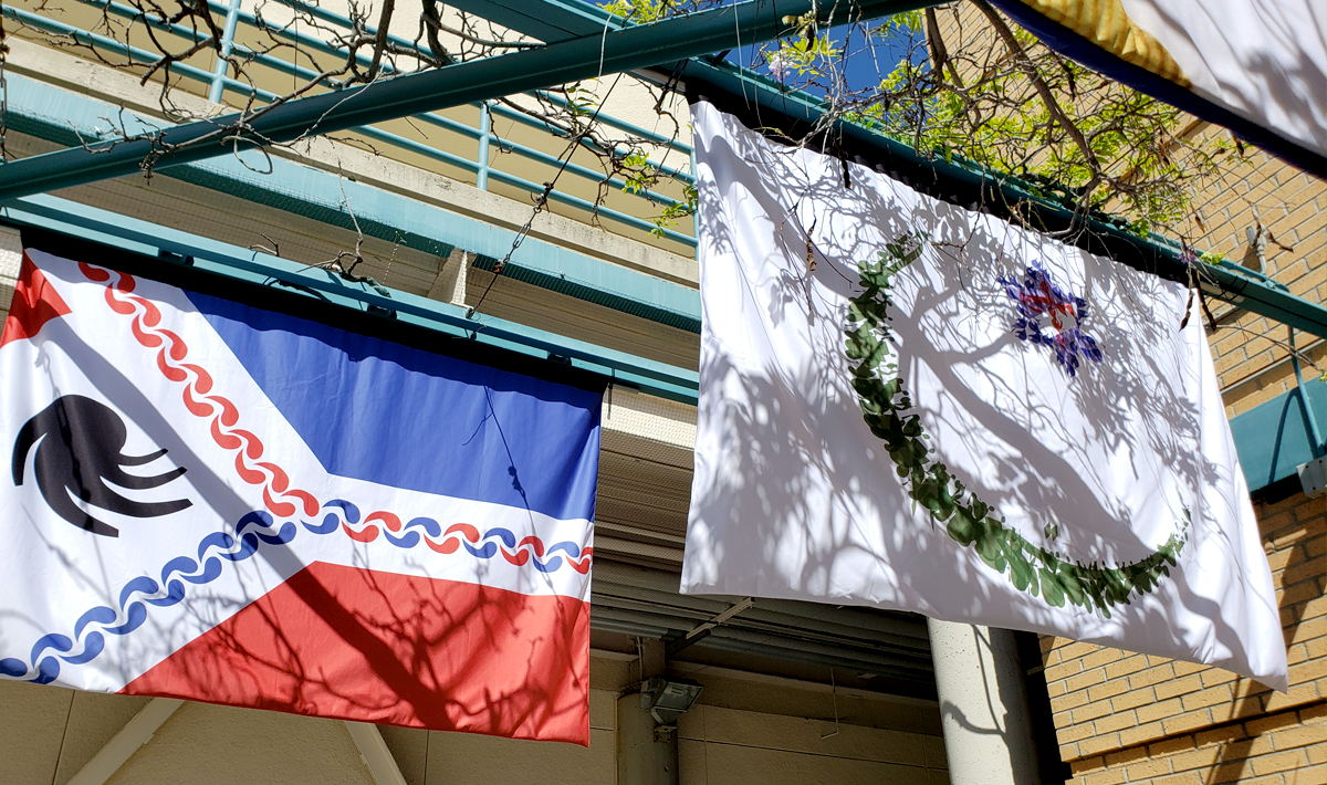 Flags on display in the Burns Fine Arts courtyard.