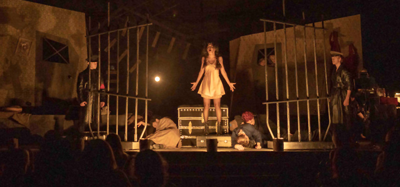 Theatre students performing onstage in a production of Cabaret.