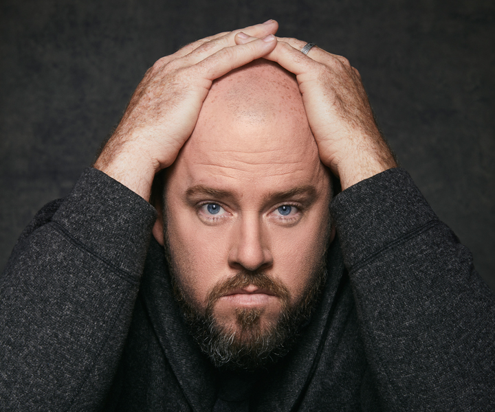 A picture of Chris Sullivan in a dark colored shirt.
