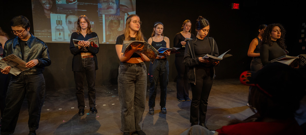 Students performing in a staged reading of The Good Body.