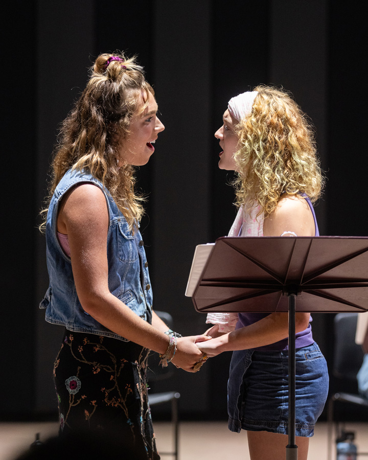 Two women singing during a performance of Jeannette.