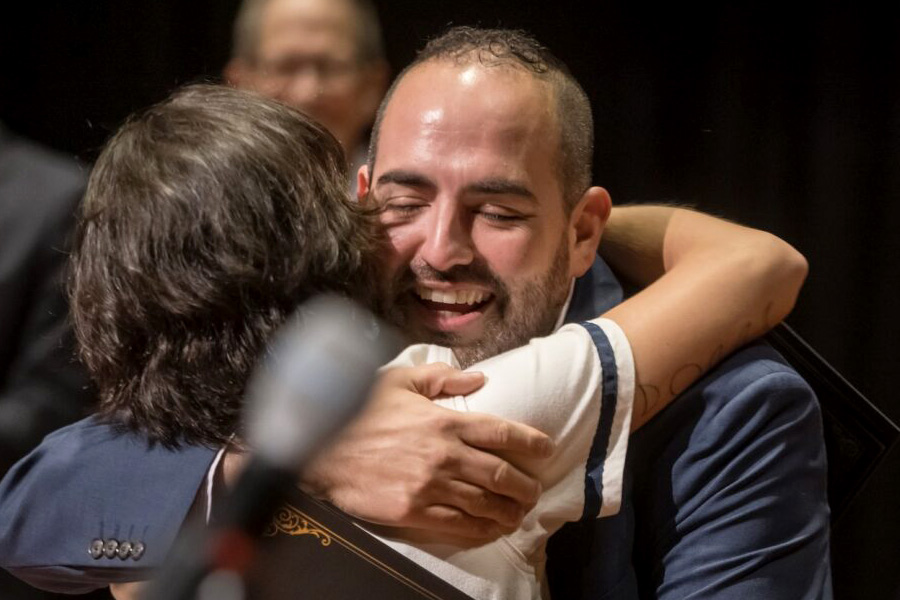 Two people embracing after winning top honors at the 96-Hour Opera Project
