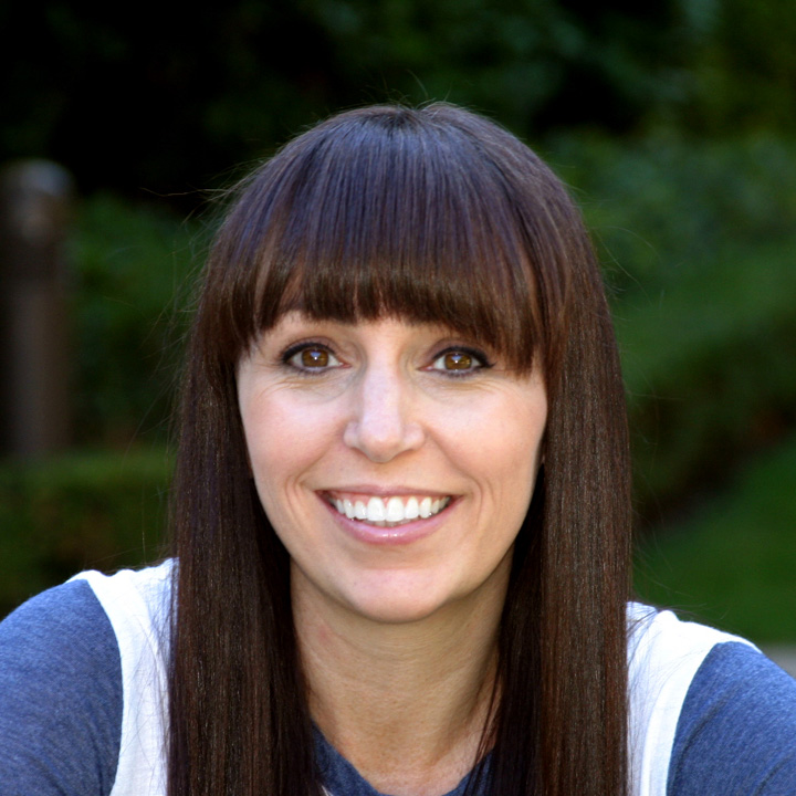 Photo of Emily Stapleton wearing a blue and white shirt.