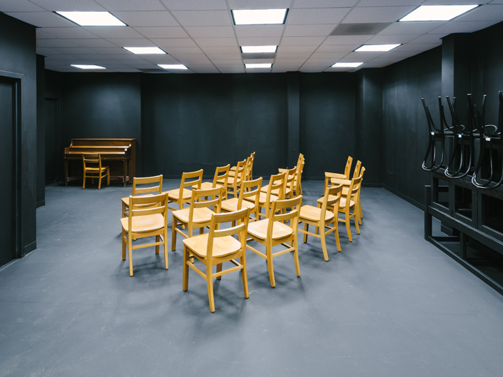 Photo of Foley 100, with chairs in the room.