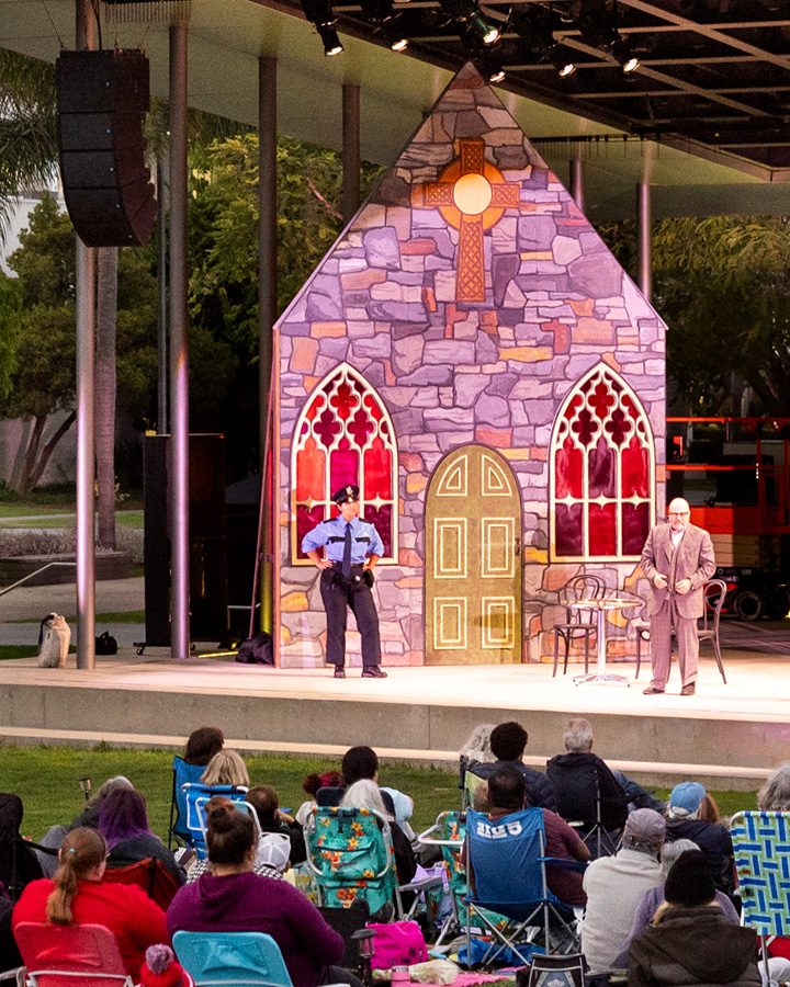 Audience members watching a performance on the Drollinger Family Stage.