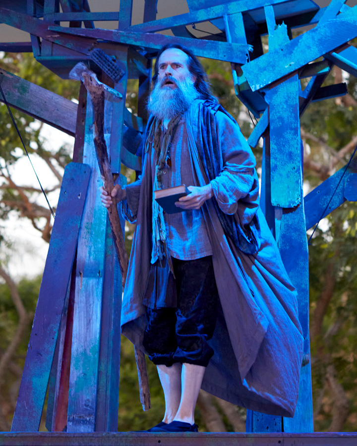 A character illuminated by blue light in The Tempest.