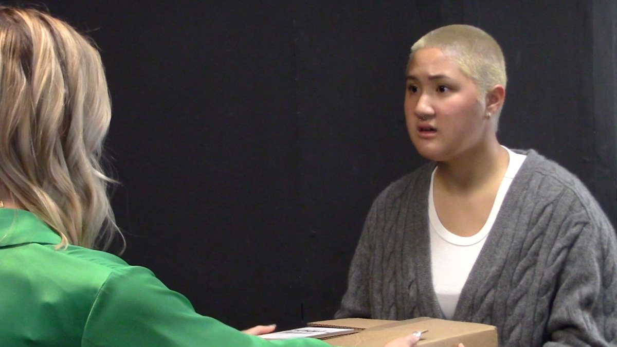 Ashley Hsu talking to a woman in green.