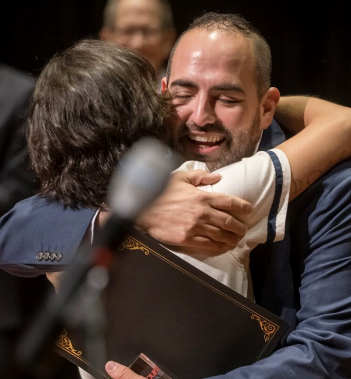 Two people embracing after winning top honors at the 96-Hour Opera Project.