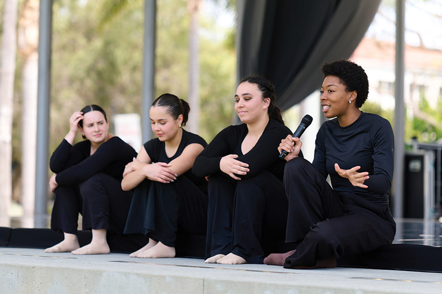 LMU Dancers speak on stage