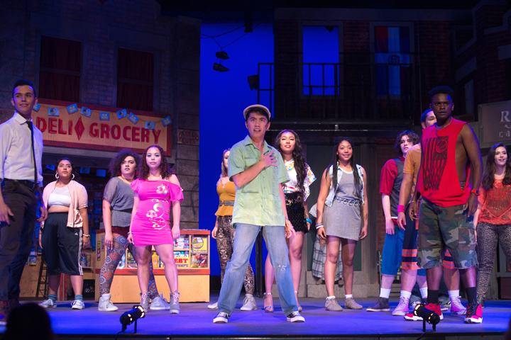Students performing onstage in a production of In The Heights.