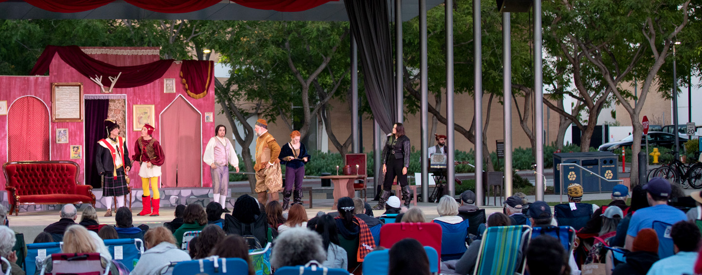 An audience watching a performance of The Merry Wives of Windsor..