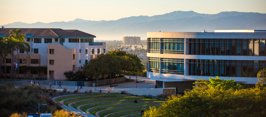 A photo of Lawton Plaza and Hannon Library at sunset..