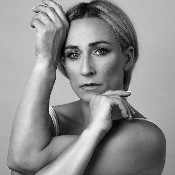 Headshot of Taryn Vander Hoop striking a pose.
